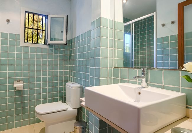 Bathroom with shower in master bedroom