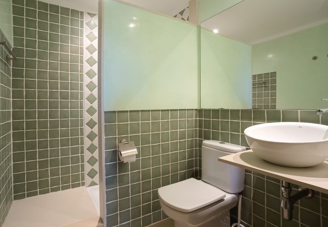 Bathroom with shower in master bedroom